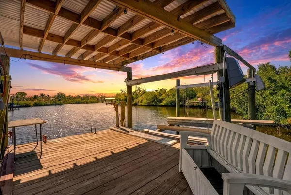 a view of a balcony with wooden floor