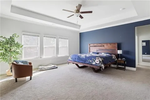 a bedroom with a bed and a couch