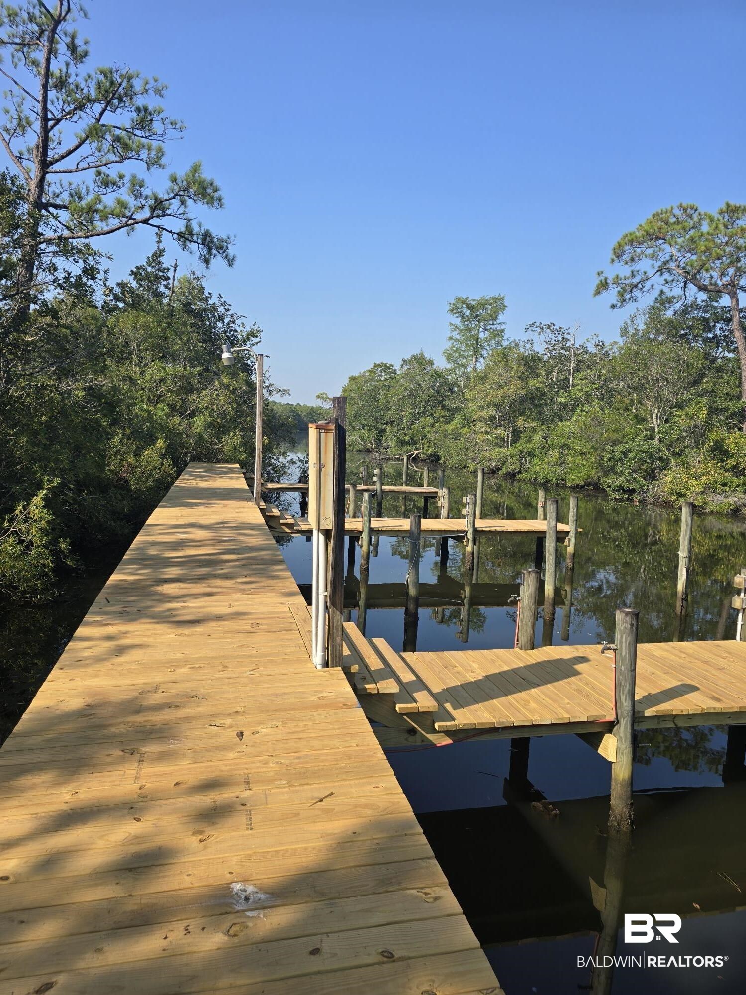 4055 Riviere Du Chien Road Mobile, AL 36693 - Photo 50 of 63 Dock area featuring a water view