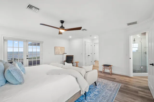 a view of a chair and tables in the balcony