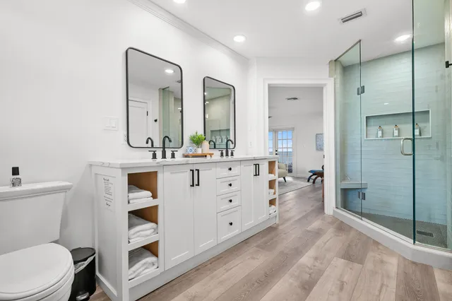 a view of a patio with table and chairs with wooden floor