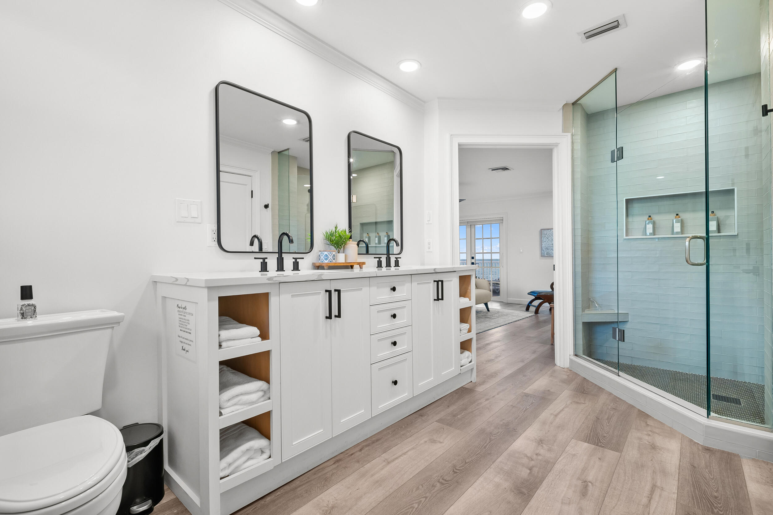 12376 Florida A1A Vero Beach, FL 32963 - Photo 21 of 92 a spacious bathroom with a toilet a sink a mirror and a shower