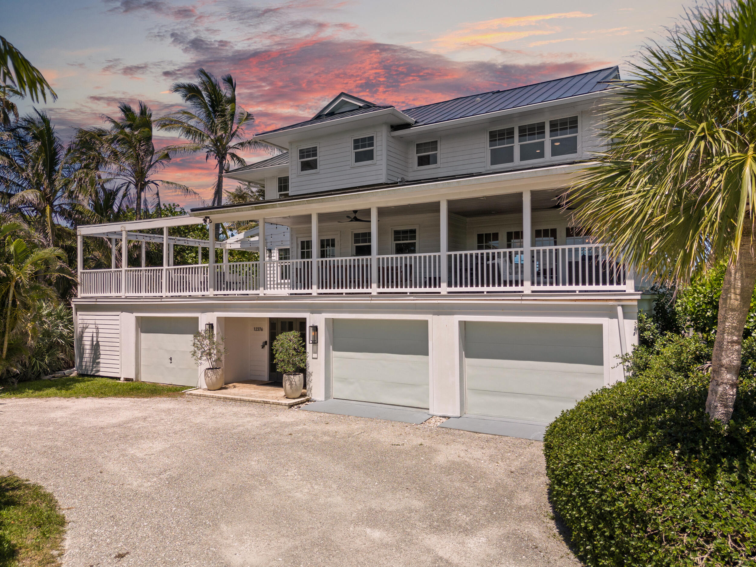12376 Florida A1A Vero Beach, FL 32963 - Photo 5 of 92 front view of a house with a yard