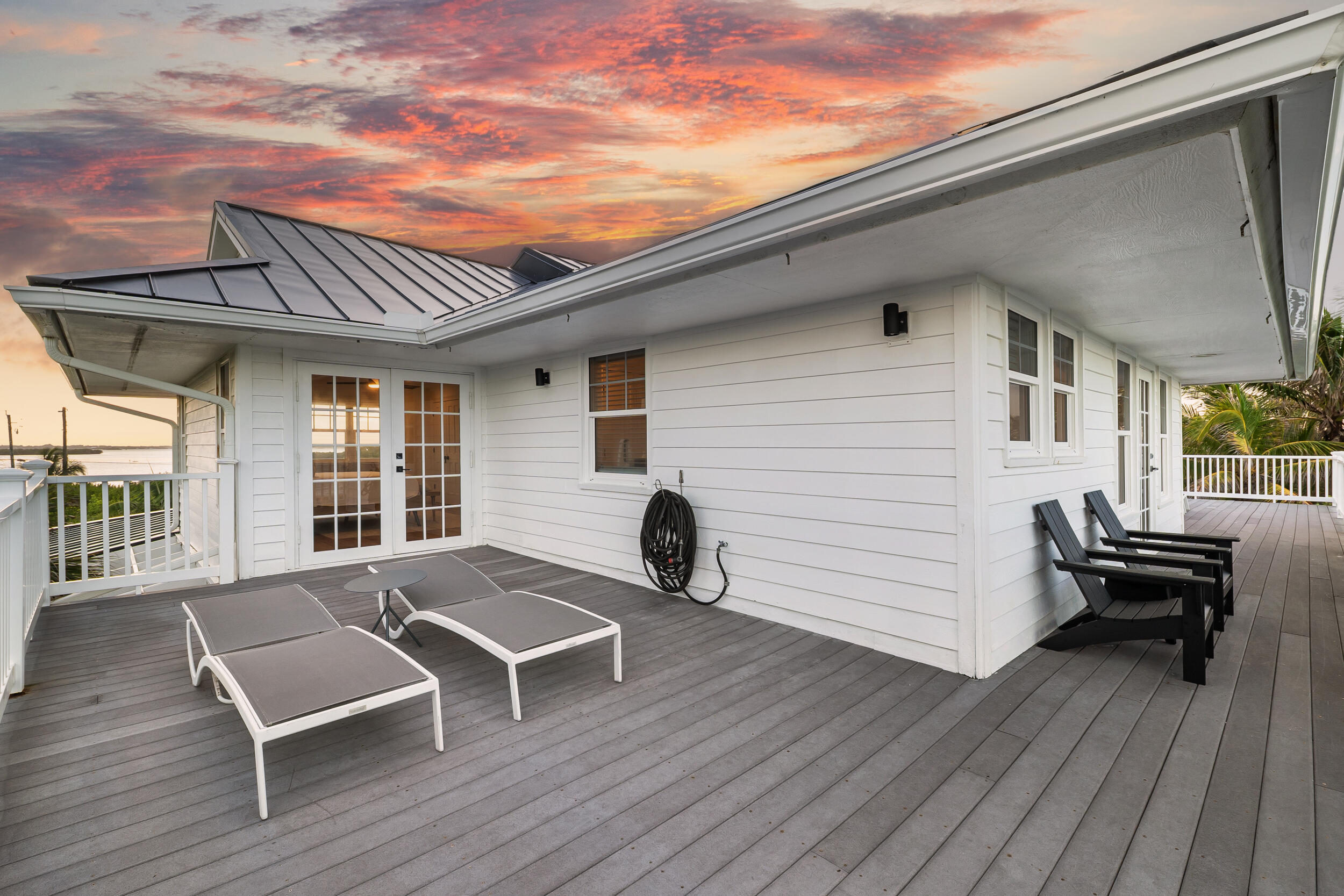 12376 Florida A1A Vero Beach, FL 32963 - Photo 78 of 92 a view of a roof deck with wooden floor and seating space