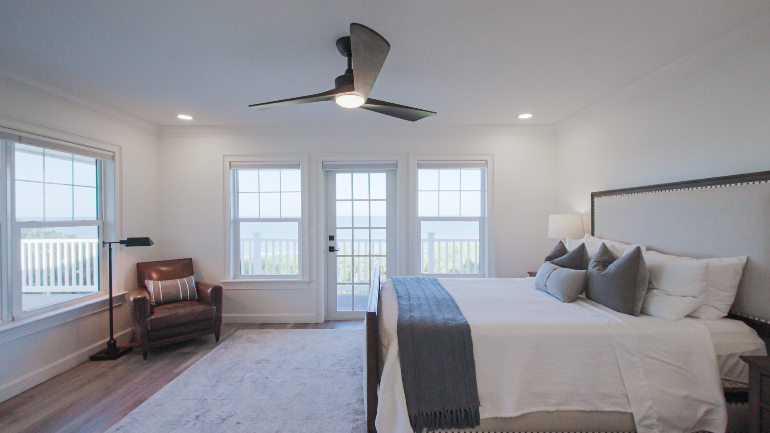 12376 Florida A1A Vero Beach, FL 32963 - Photo 85 of 92 a bedroom with a bed a couch and a large window