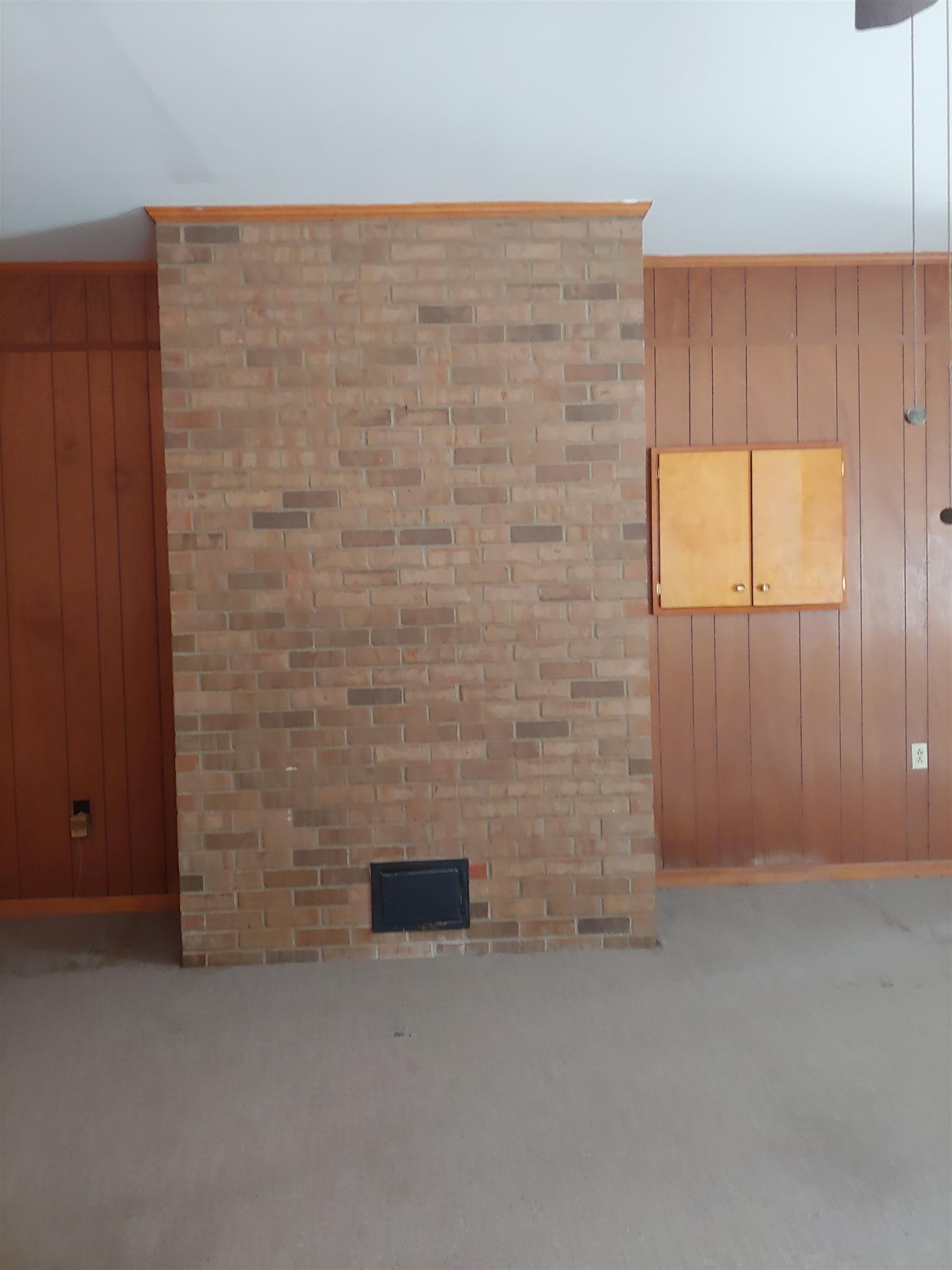 718 North Rutherford Boulevard Murfreesboro, TN 37130 - Photo 25 of 30 Back of den fireplace in playroom with ash box. Enclosed electrical box.