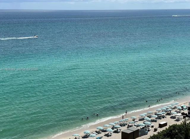 a view of swimming pool with outdoor seating