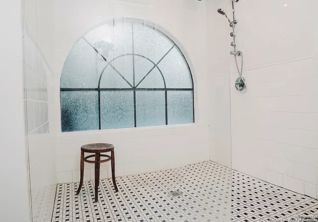 a picture of a bench in front of a door