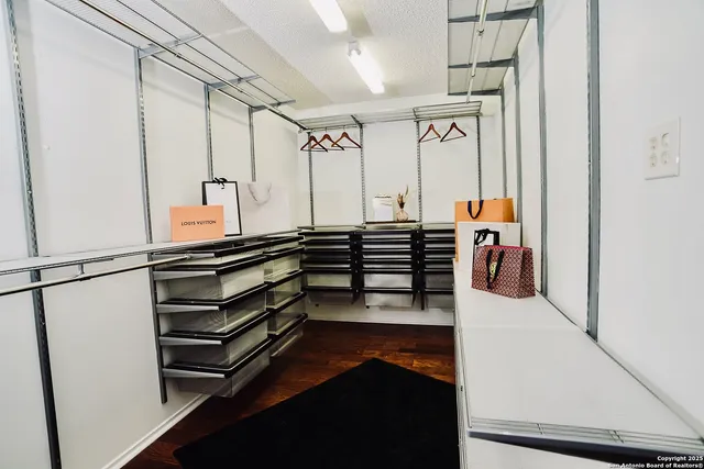 a hallway with stairs and furniture