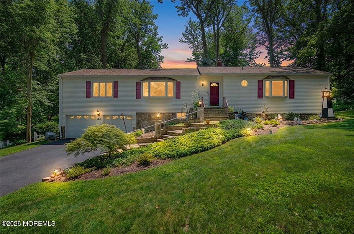 323 Arlene Terrace Aberdeen, NJ 07747 - Photo 1 of 28 front view of house with a yard
