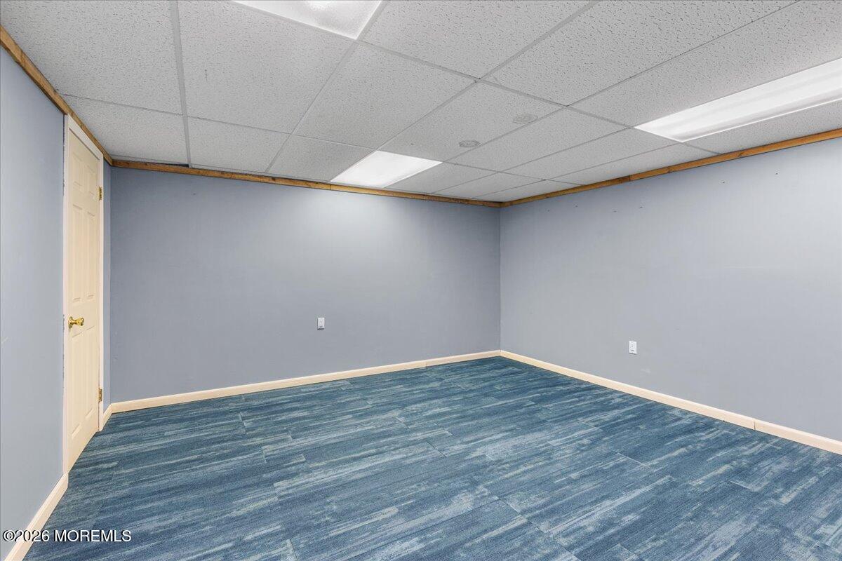 323 Arlene Terrace Aberdeen, NJ 07747 - Photo 22 of 28 a view of an empty room with wooden floor