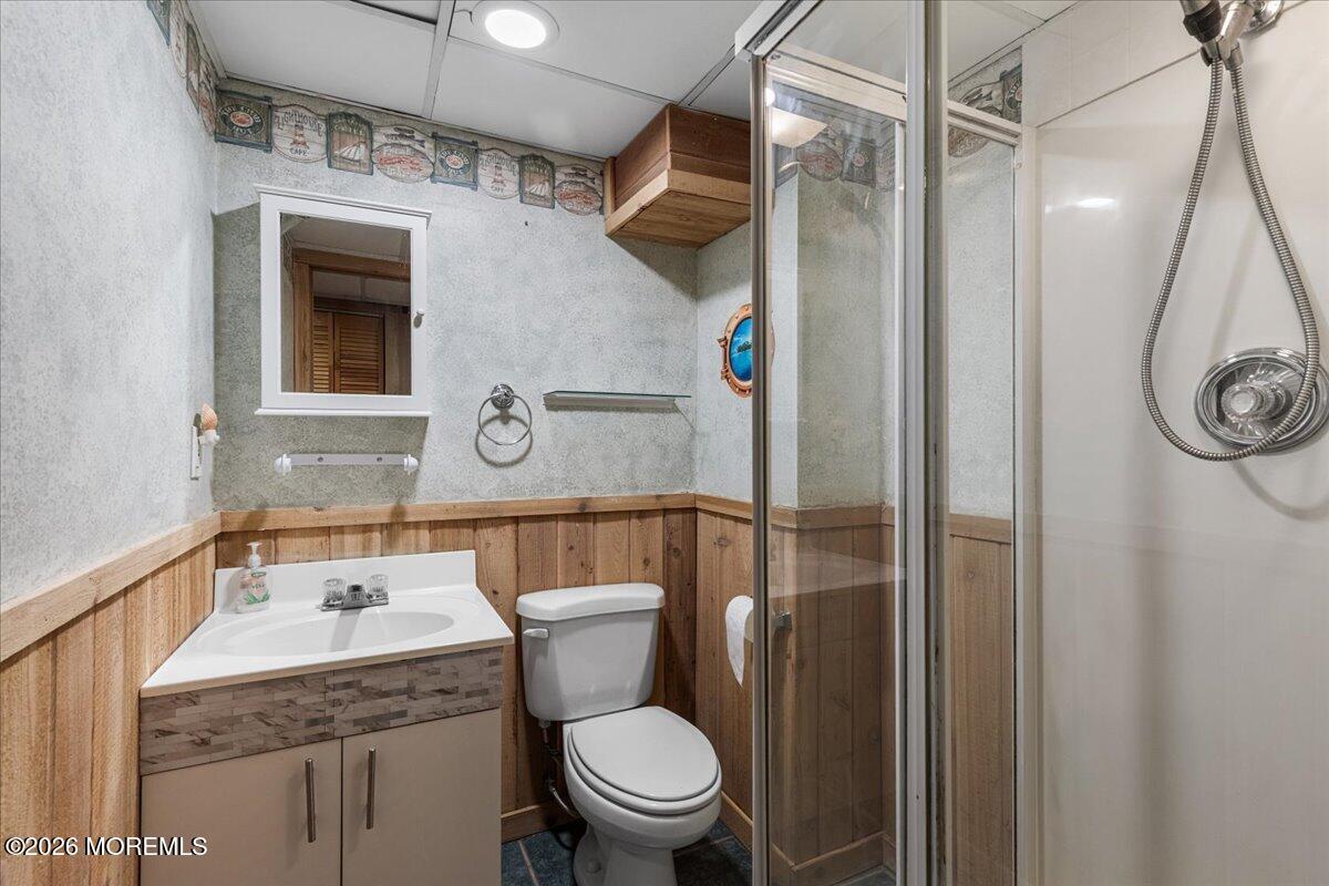 323 Arlene Terrace Aberdeen, NJ 07747 - Photo 24 of 28 a bathroom with a sink a toilet and shower