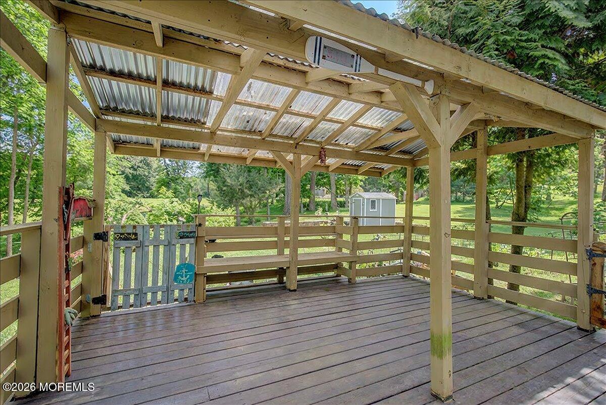 323 Arlene Terrace Aberdeen, NJ 07747 - Photo 25 of 28 a view of a wooden deck with a yard