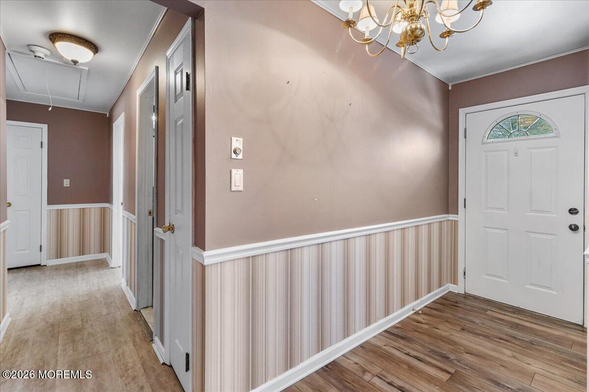 323 Arlene Terrace Aberdeen, NJ 07747 - Photo 4 of 28 a view of a hallway with wooden floor and staircase