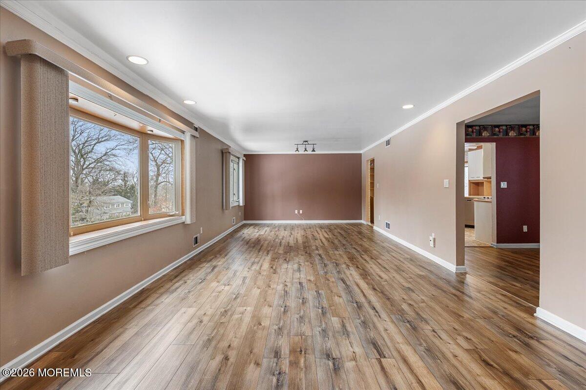 323 Arlene Terrace Aberdeen, NJ 07747 - Photo 5 of 28 a view of empty room with wooden floor