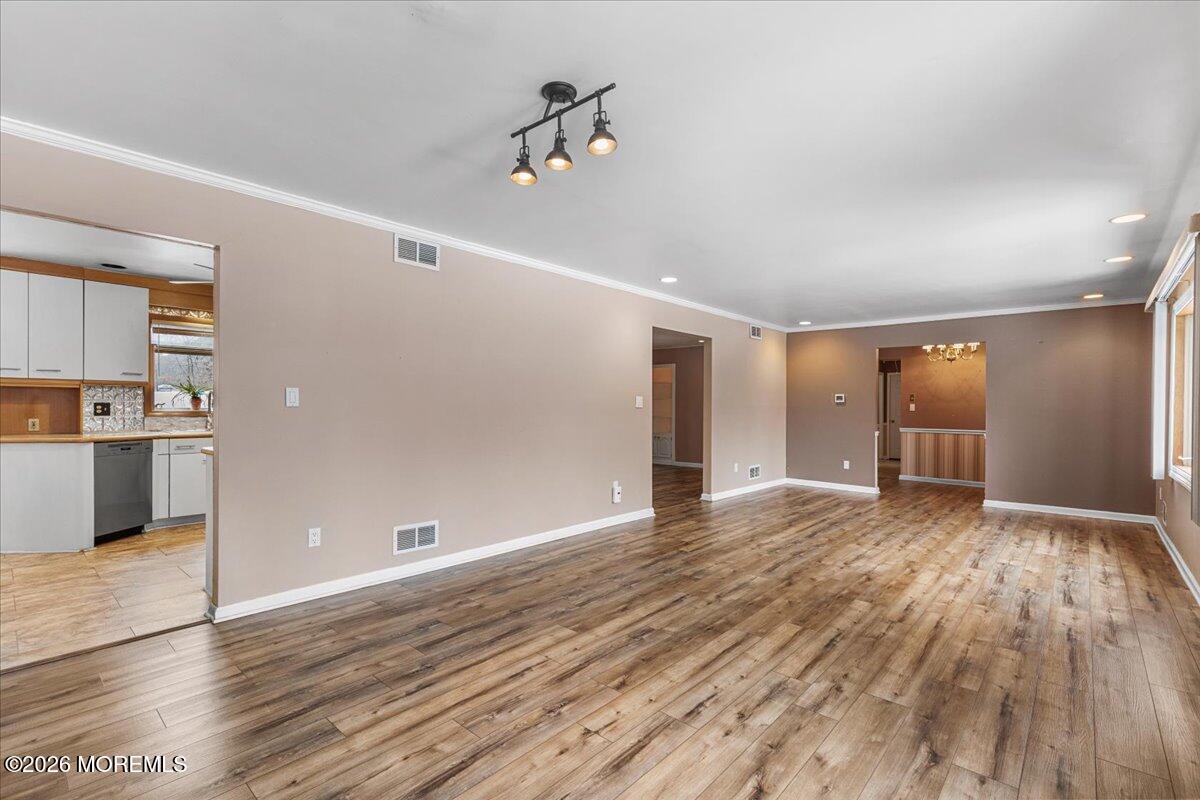 323 Arlene Terrace Aberdeen, NJ 07747 - Photo 7 of 28 a view of empty room with wooden floor