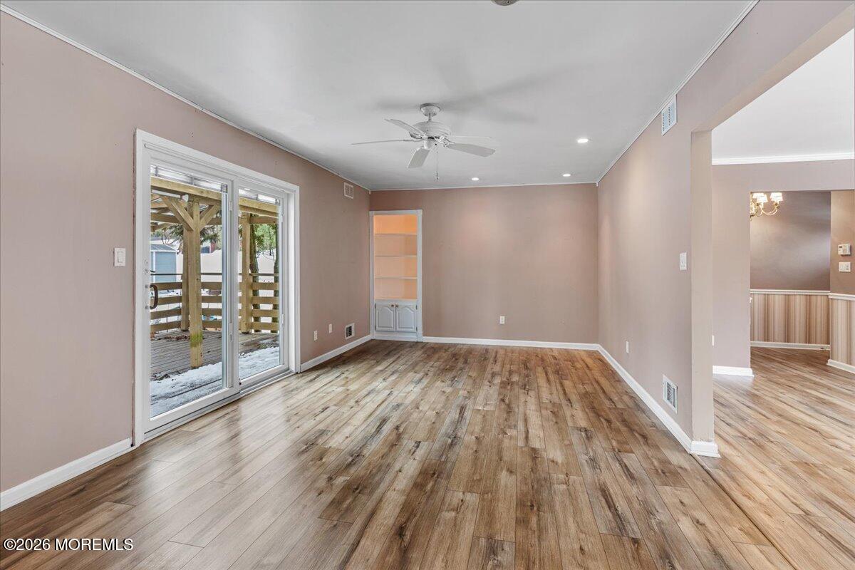 323 Arlene Terrace Aberdeen, NJ 07747 - Photo 9 of 28 wooden floor in an empty room with a window