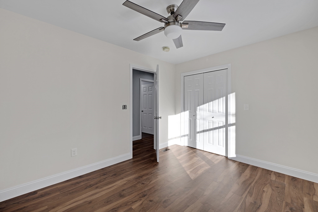 132 Kibbe Road East Longmeadow, MA 01028 - Photo 23 of 32 an empty room with wooden floor fan and windows