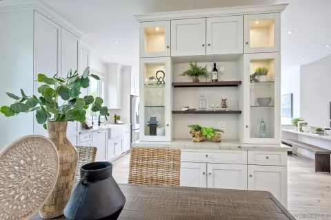 a view of living room with a bed furniture and a potted plant
