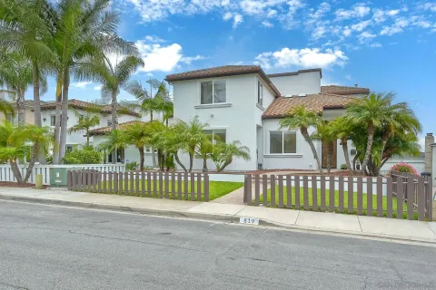 a view of a house with a fence