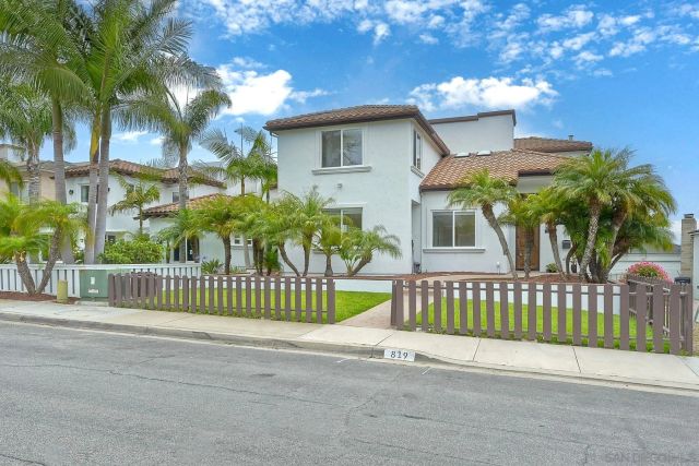 a view of a house with a fence