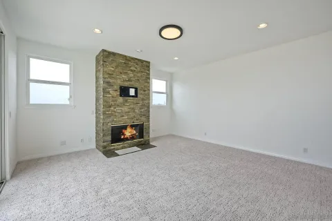 a view of roof deck with furniture and city view
