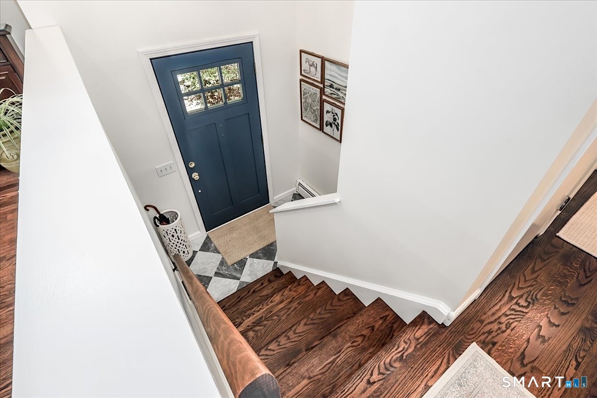 23 Cedar Hill Road Newtown, CT 06470 - Photo 25 of 30 Foyer Featuring New Light Fixture, New Custom Front Door and Custom Tiling