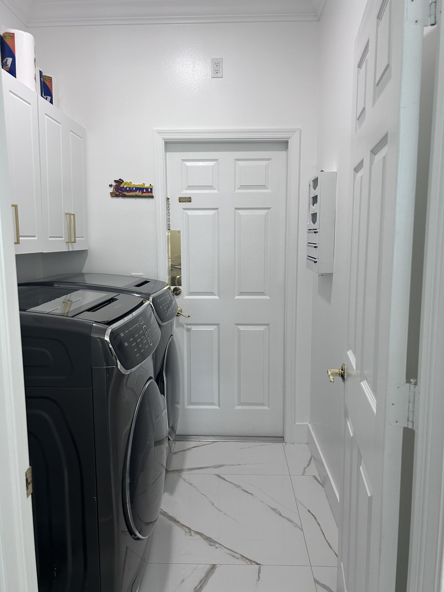 3158 Southwest Martin Street Port St. Lucie, FL 34953 - Photo 18 of 26 a utility room with dryer and washer