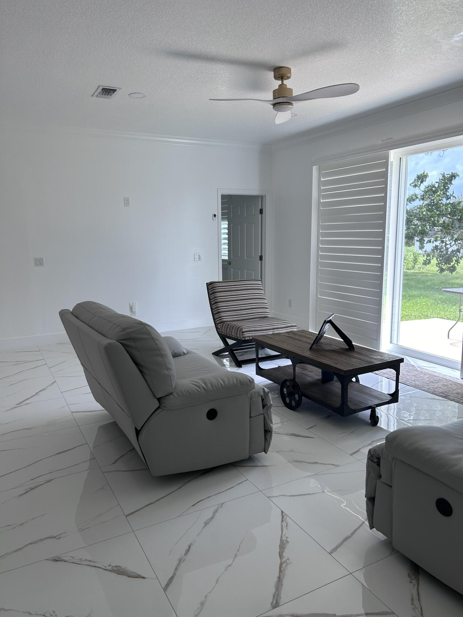 3158 Southwest Martin Street Port St. Lucie, FL 34953 - Photo 19 of 26 a living room with furniture and a window
