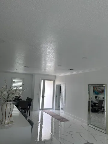 a lobby with furniture and window