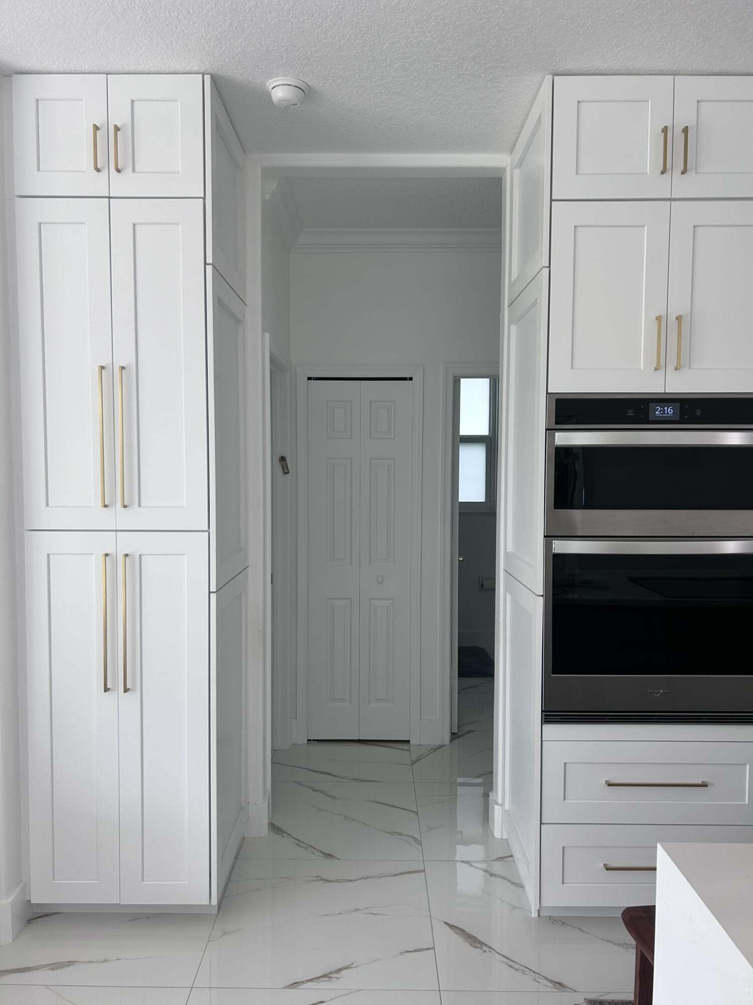 3158 Southwest Martin Street Port St. Lucie, FL 34953 - Photo 26 of 26 a view of a kitchen with cabinets and stainless steel appliances