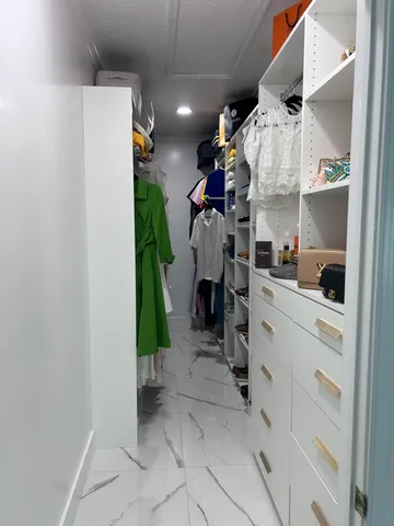 a view of a livingroom with chairs