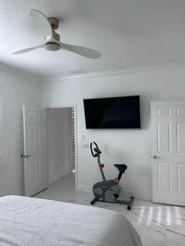 a view of a dining room with tables and chairs