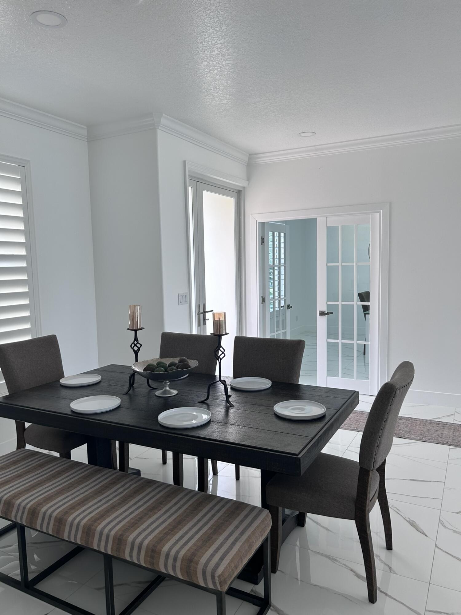 3158 Southwest Martin Street Port St. Lucie, FL 34953 - Photo 6 of 26 a view of a dining room with tables and chairs