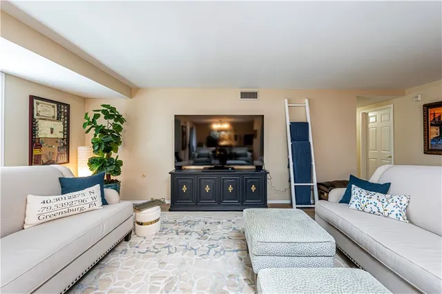 a living room with a couch and a flat screen tv