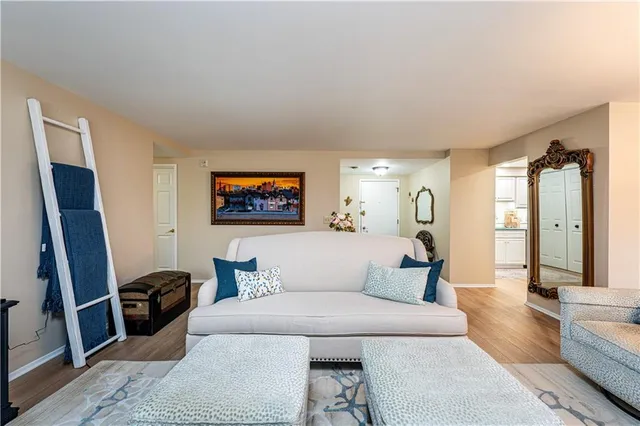 a bedroom with furniture and a flat screen tv