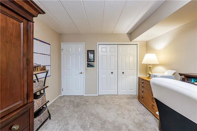 a room with a bed and furniture