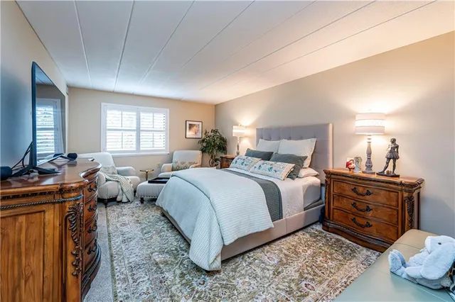 a bed room with a bed and a couch