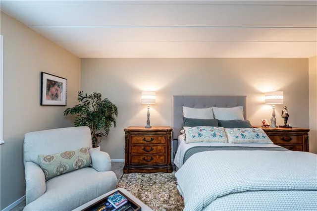 a bedroom with a bed and a couch