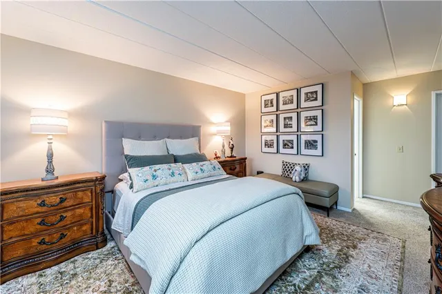 a bed room with a bed and a lamp