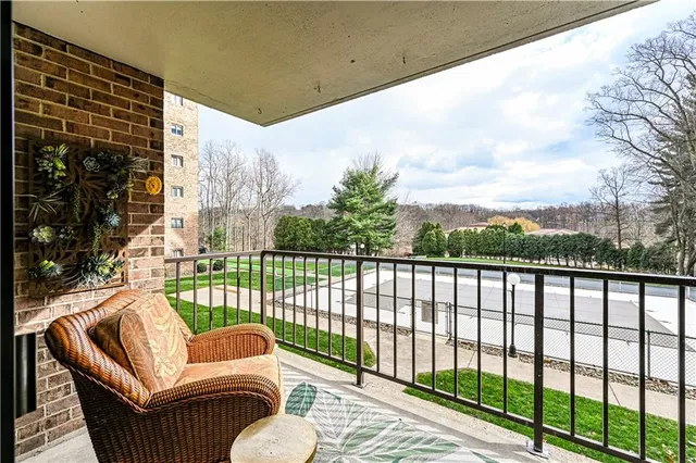 a view of balcony and yard