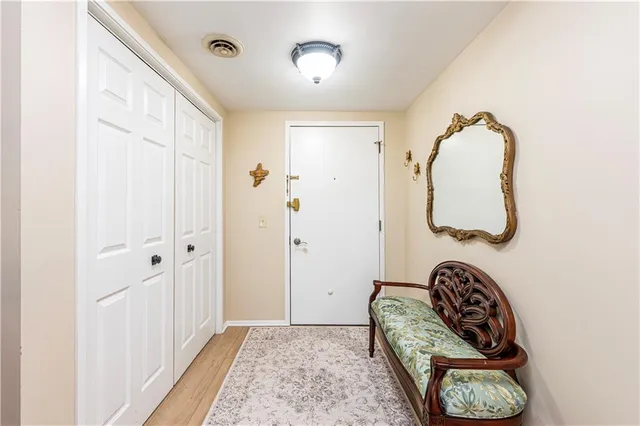 a bedroom with a bed and a mirror