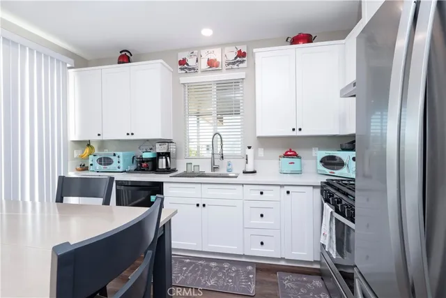 a kitchen with a sink and a window