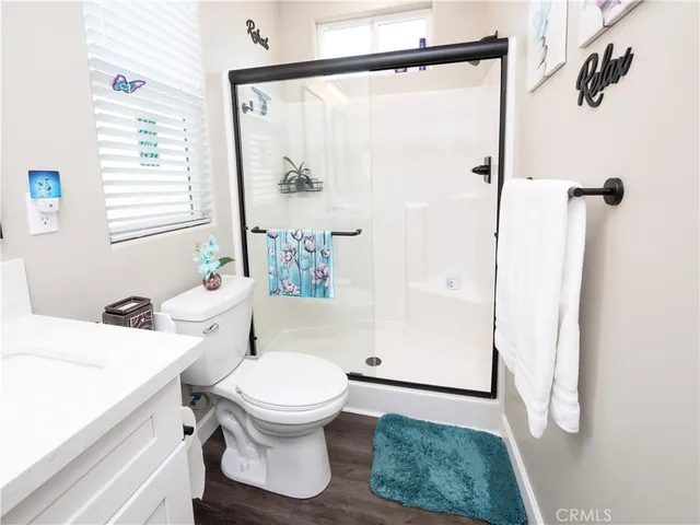 a bathroom with double vanity sink and two mirror