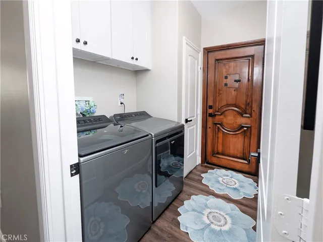 a view of a balcony with furniture and wooden floor