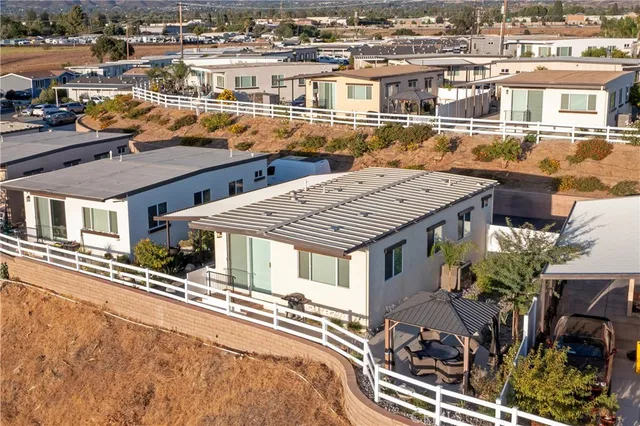 a view of a patio with table and chairs