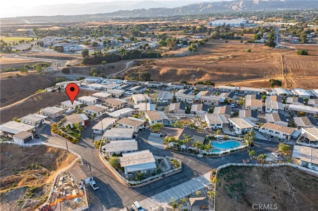an aerial view of a house with a swimming pool