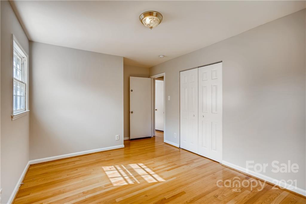 7326 Riding Trail Road Charlotte, NC 28212 - Photo 22 of 33 a view of an empty room with a window