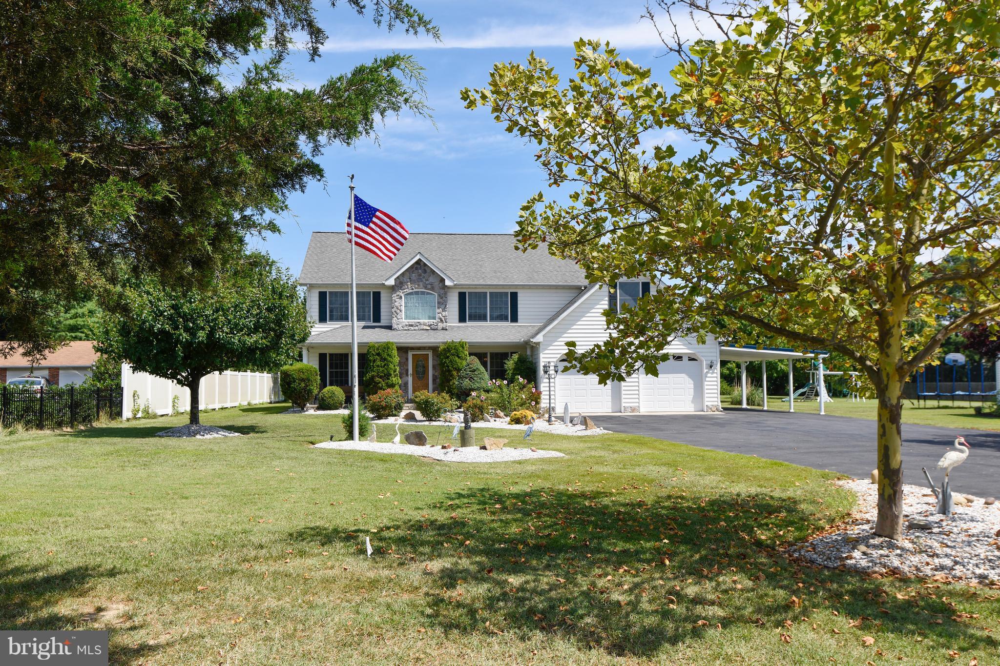 122 Cedar Road Chester, MD 21619 - Photo 2 of 28 a front view of house with a garden