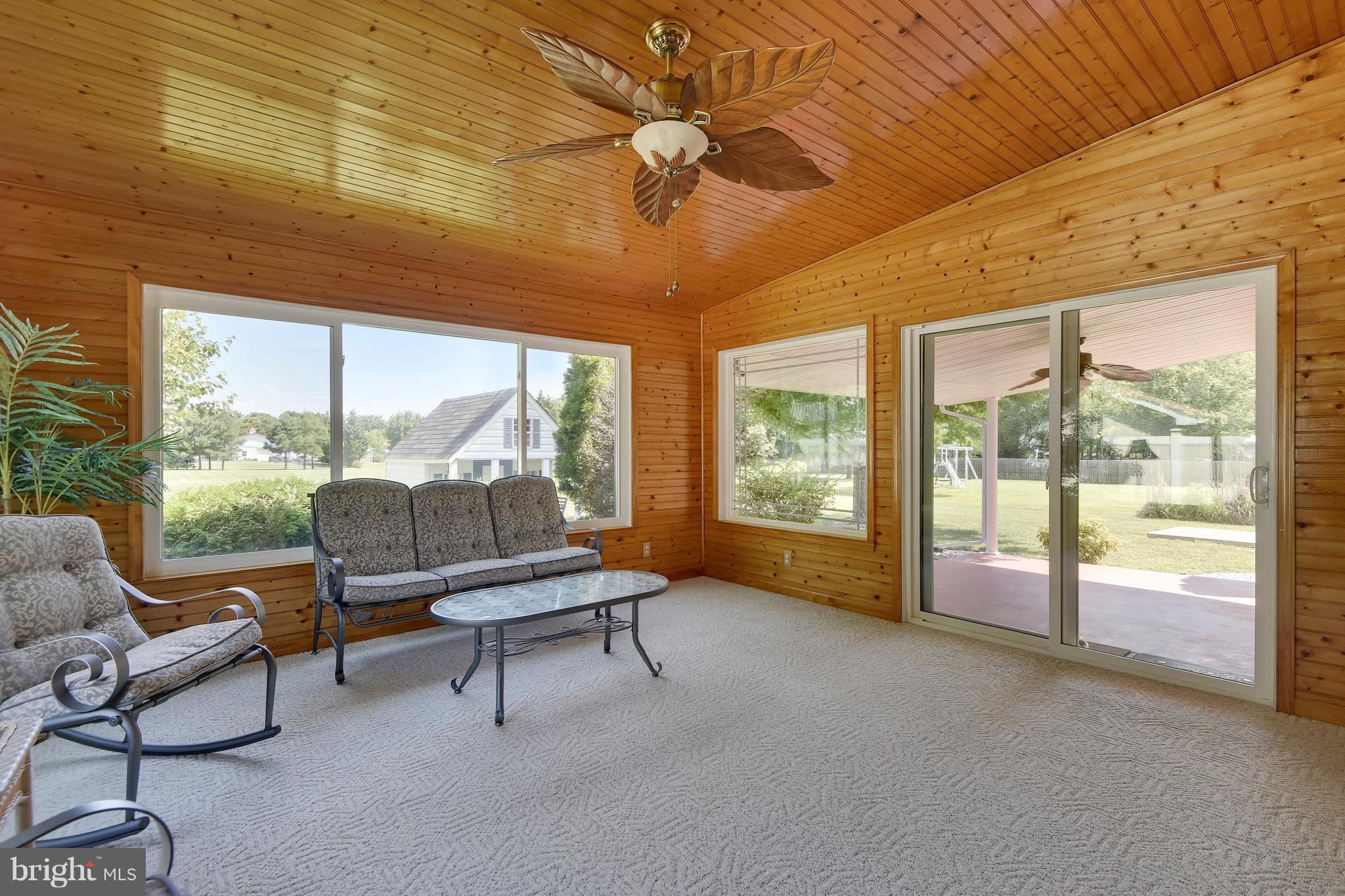 122 Cedar Road Chester, MD 21619 - Photo 12 of 28 a living room with furniture and a large window